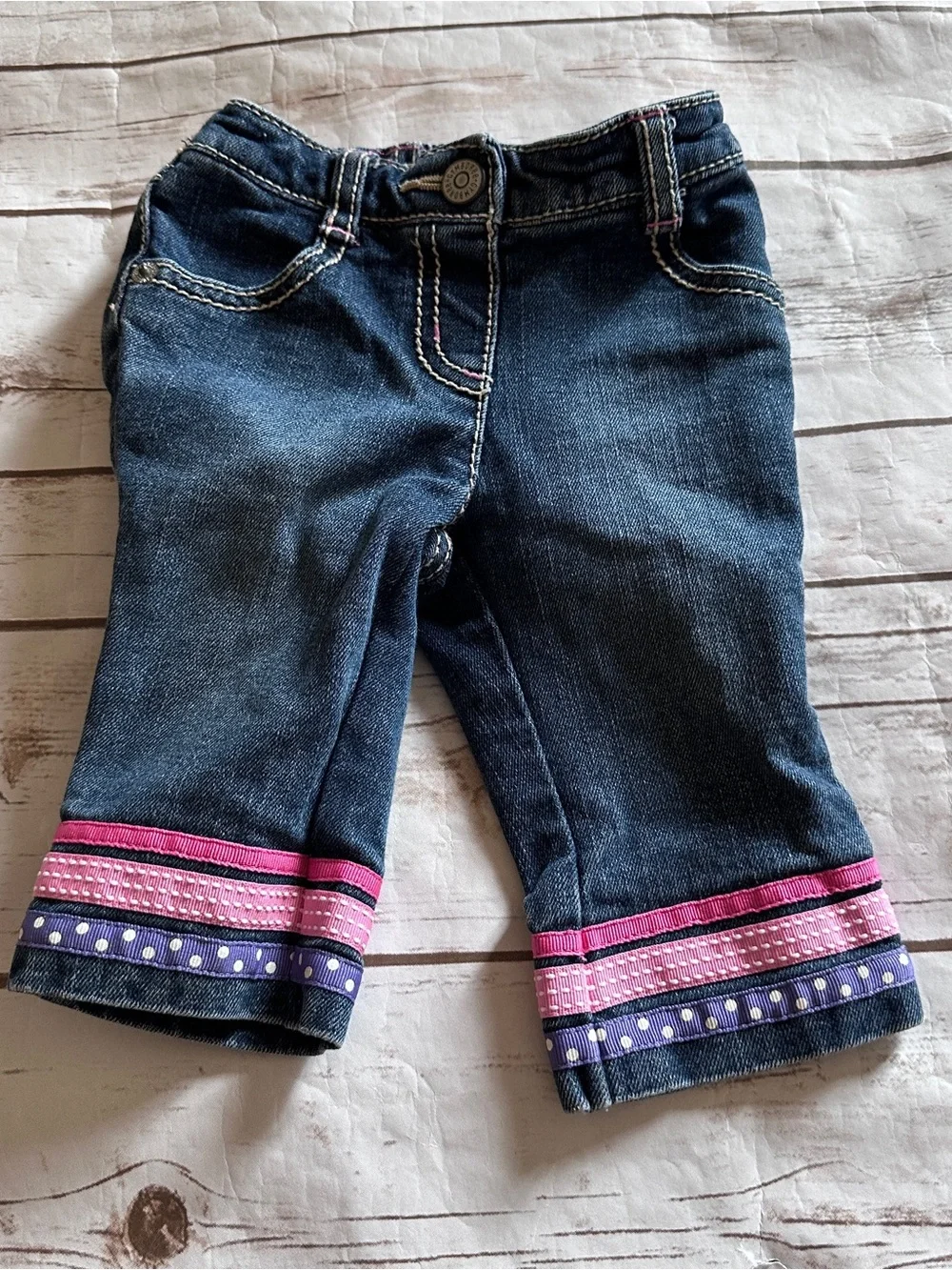 Gymboree jeans with pink and purple polka dot trim, size 3-6 months. Vguc.